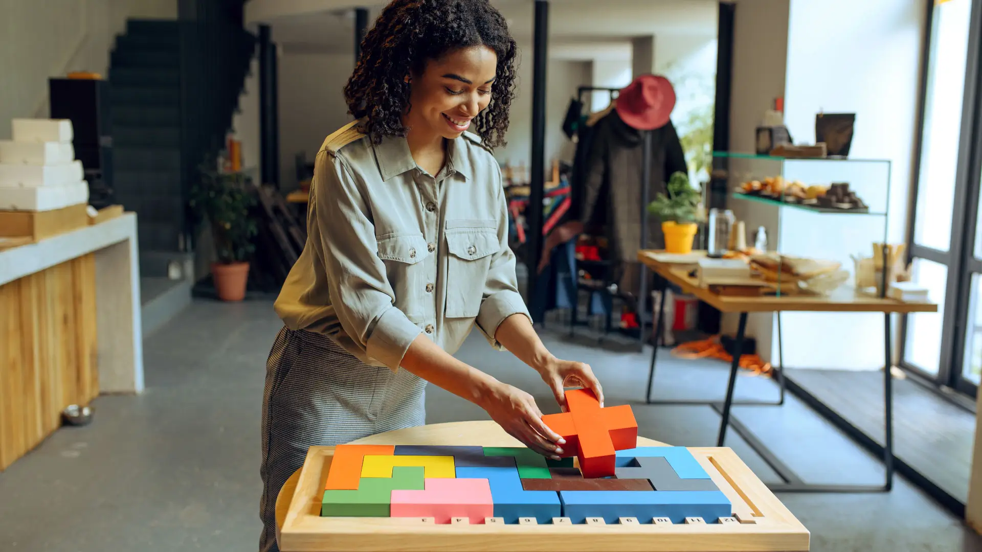 woman using large puzzle pieces