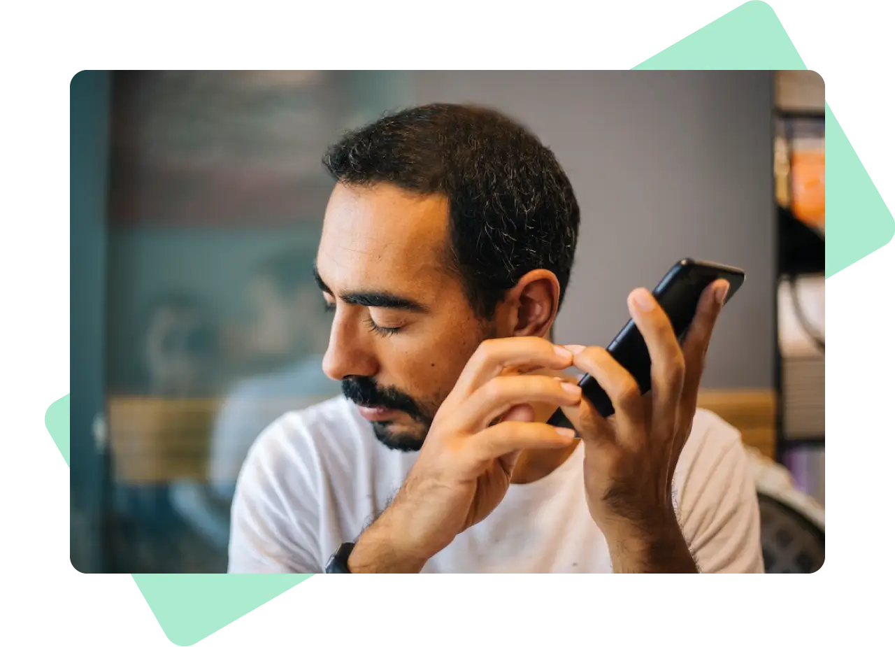 A blind man using a smartphone.