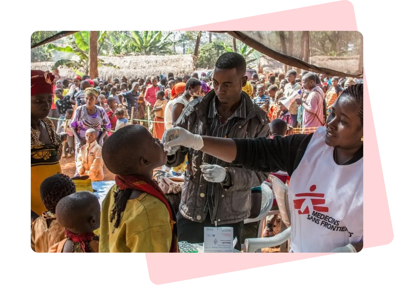 Doctors administering medicine to a child.