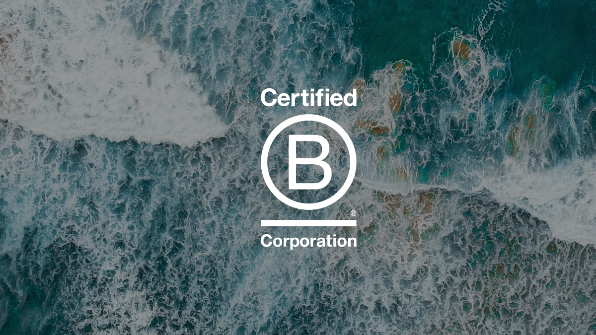 Certified B Corp logo shown over an aerial view of the ocean.